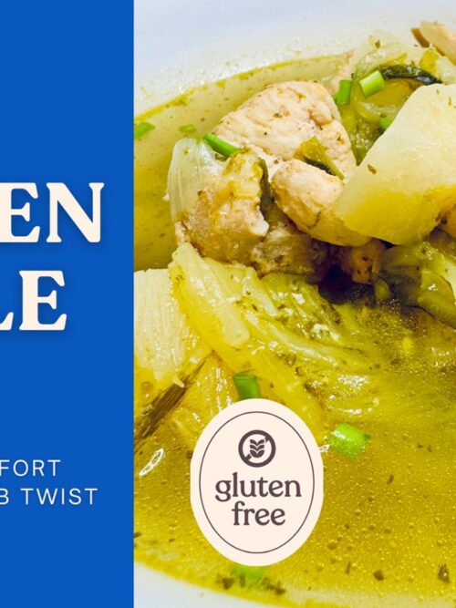 Chicken Zoodle Soup served in a bowl with tender chicken, vegetables, and golden Latin-inspired broth garnished with fresh herbs
