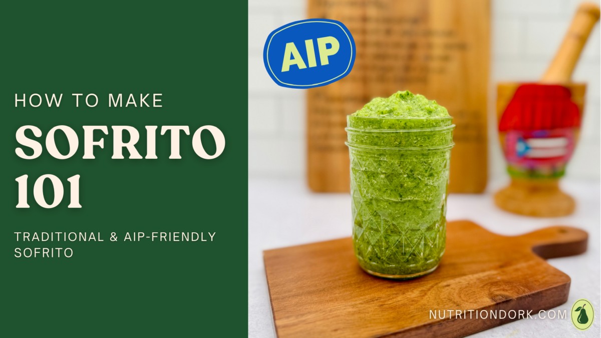 Sofrito in a jar showing a vibrant green AIP-friendly Puerto Rican sofrito recipe made with fresh herbs and blended vegetables on a wooden board