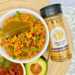 Plant based arroz con pollo served with avocado and beans, a flavorful choice for vegan recipes or meal prep.