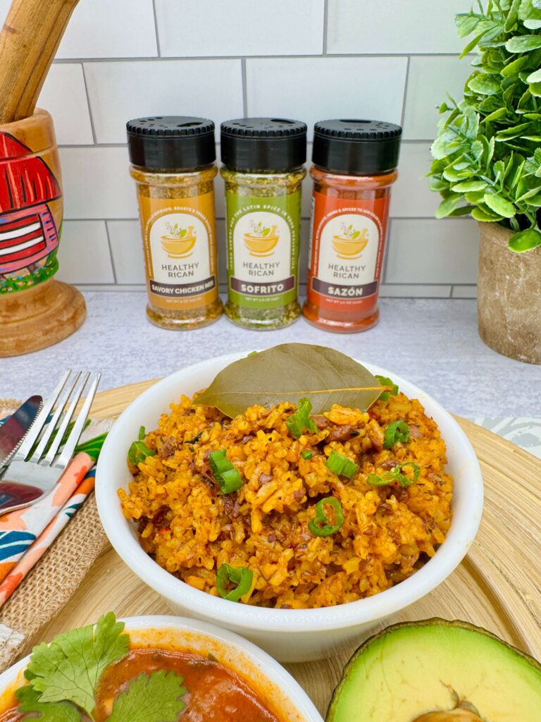 Plant based arroz con pollo served in a bowl with green onions and bay leaf, a flavorful option for vegan recipes and meatless dinner ideas.